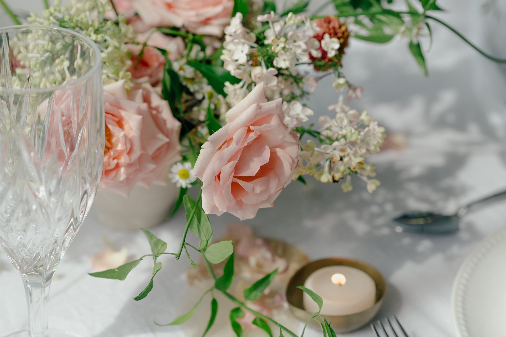 Elegant pink roses and a tea light for valentines day